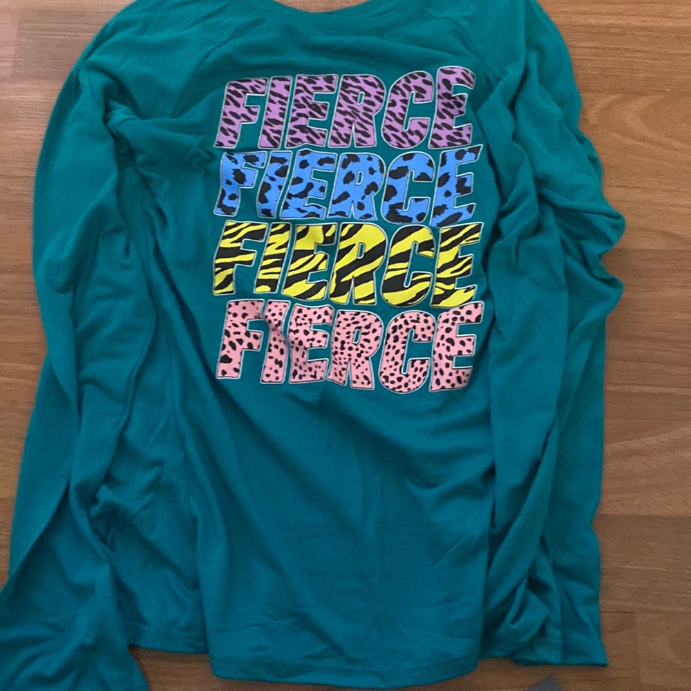 Teal shirt with “FIERCE” writing on it. very cute